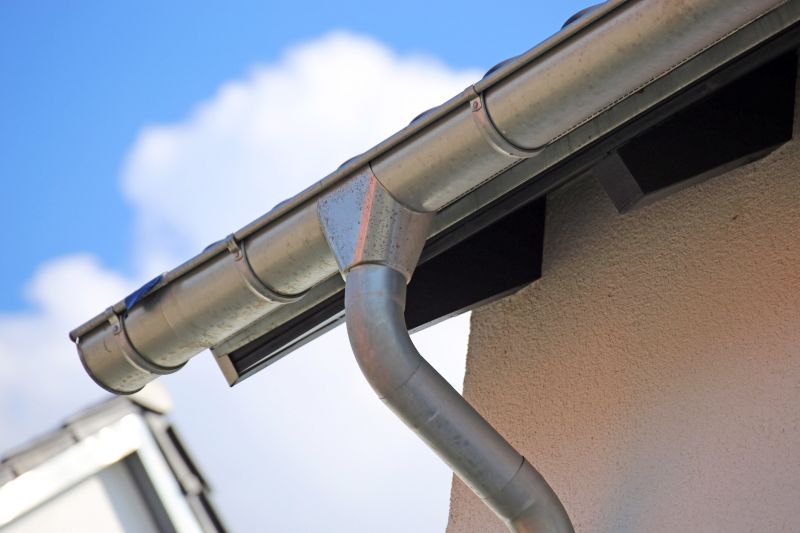 Finished gutter system with downspouts